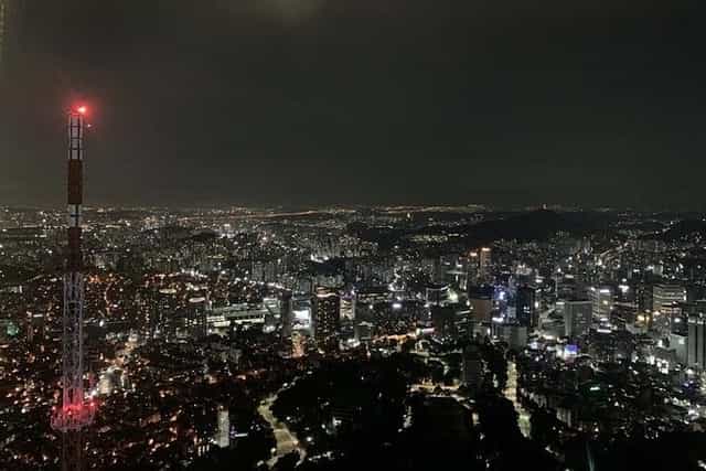 Observation Deck at N Seoul Tower with vibrant city lights, ideal for corporate events.