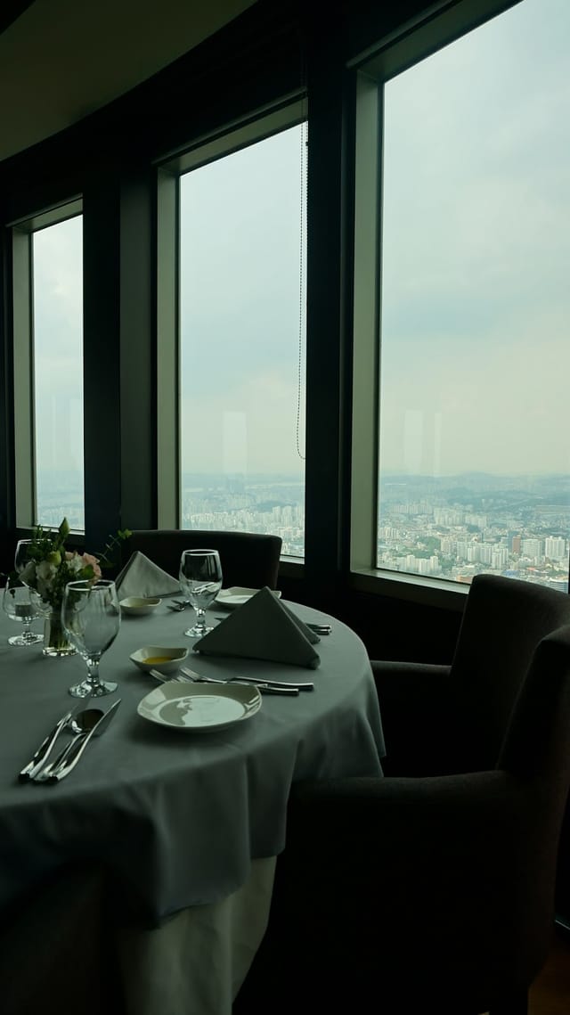 Sophisticated dining setup at n·GRILL, N Seoul Tower for corporate events and gatherings.