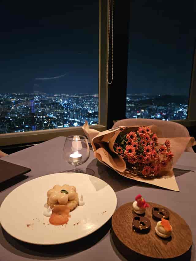 Elegant dessert table at Revolving Restaurant, N Seoul Tower, perfect for corporate dinners.