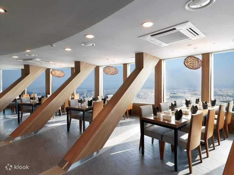 Modern dining space at N Seoul Tower with panoramic views for corporate events.