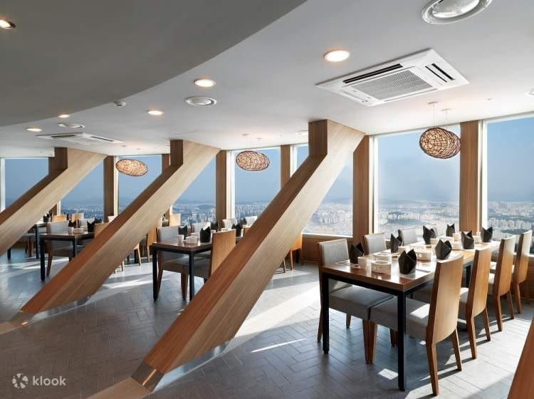 Modern dining space at N Seoul Tower with panoramic views for corporate events.