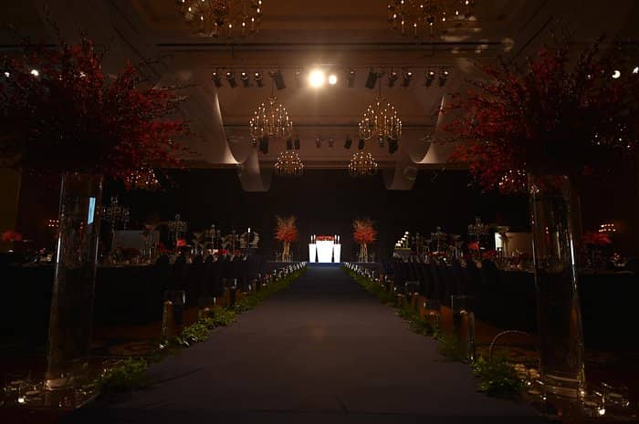 Elegant wedding chapel at Swiss Grand Hotel Seoul with floral arrangements and chandeliers.