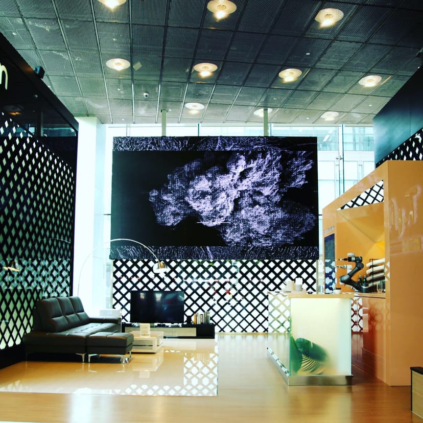 Modern Exhibition Hall with large digital display for corporate events and showcases.