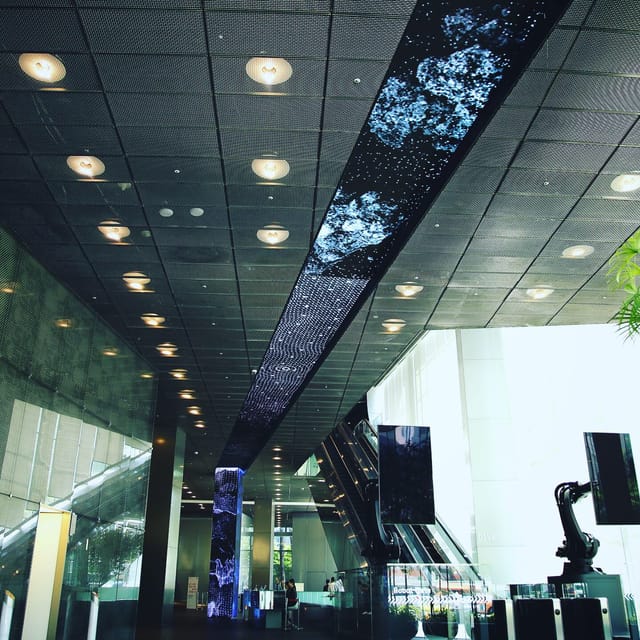 Modern Exhibition Hall with sleek ceiling, ideal for networking events and presentations.