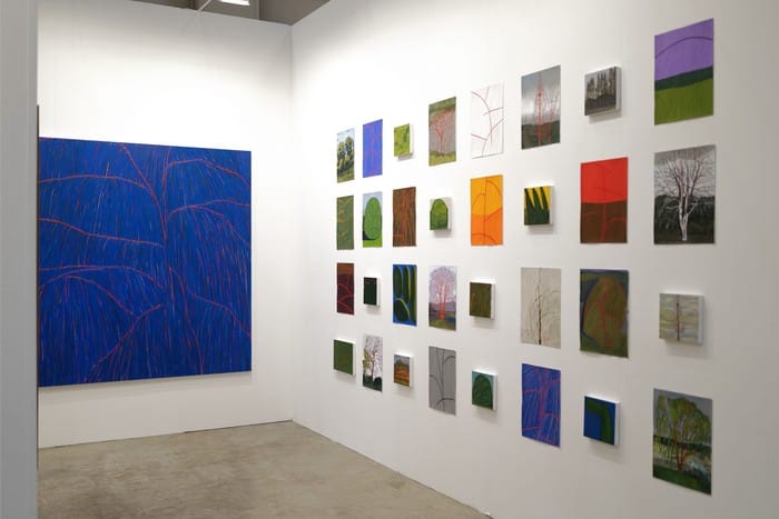 Contemporary art gallery with vibrant blue painting, ideal for creative events and exhibitions.