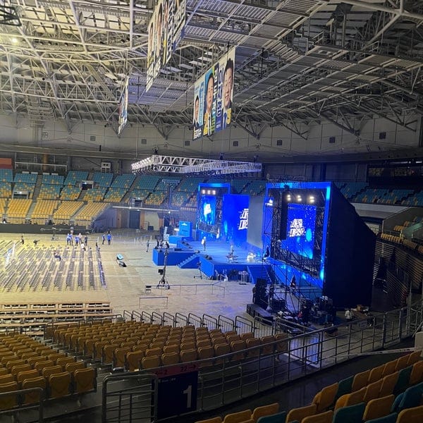 KSPO DOME event space with blue stage lighting for engaging performances in Olympic Park.