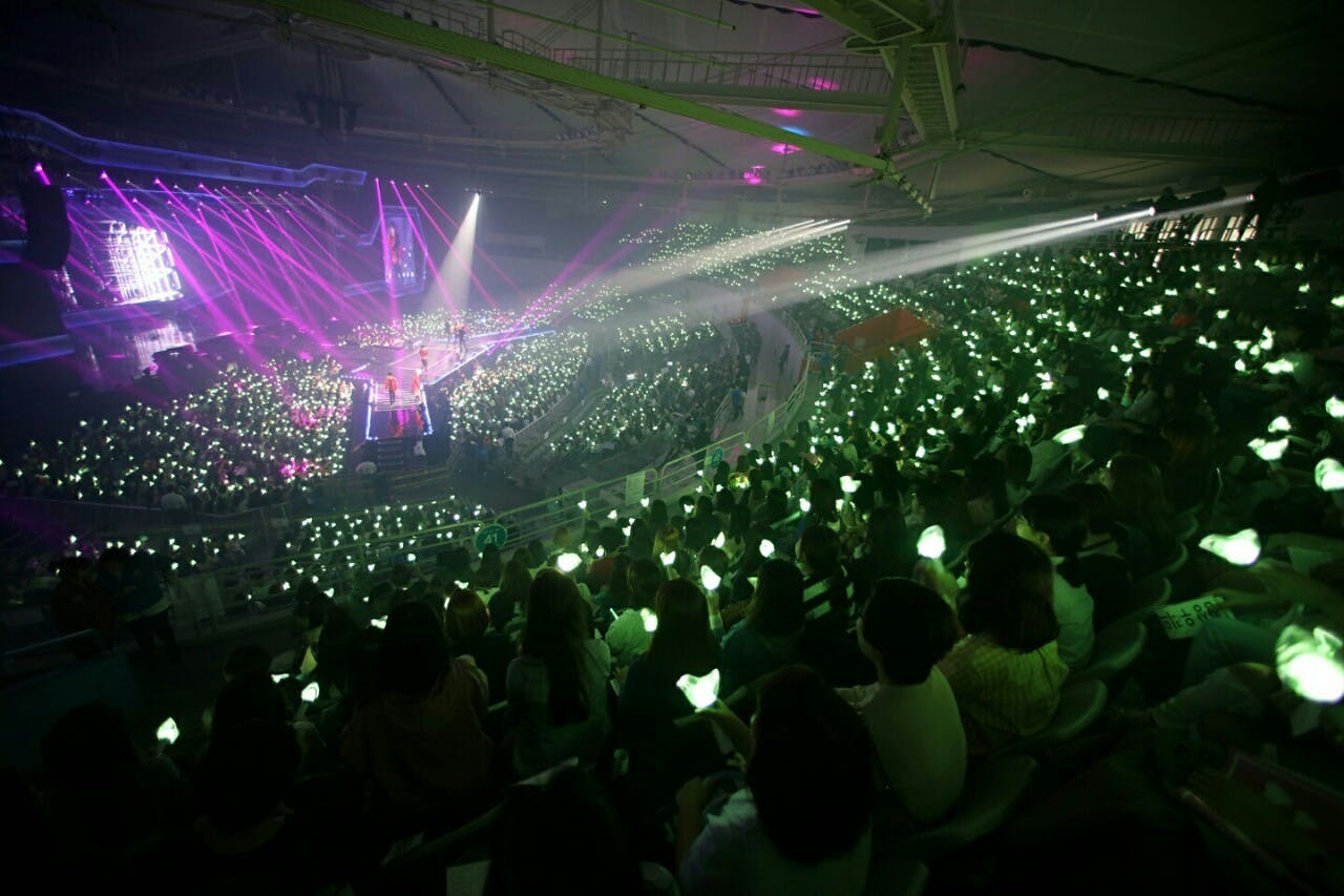 SK Handball Stadium with vibrant green lights, perfect for concerts and large events.