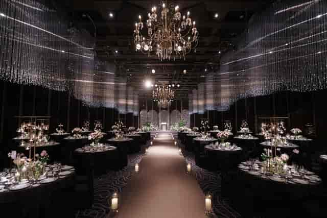 Elegant wedding chapel at The Westin Josun Seoul with floral centerpieces and warm lighting.