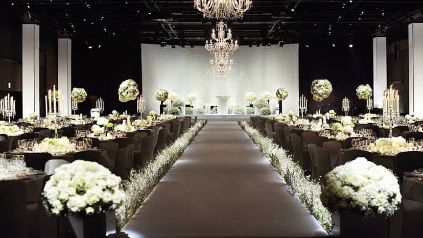 Elegant wedding chapel at The Westin Josun Seoul with floral arrangements and chandeliers.