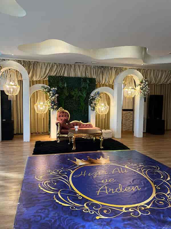Elegant wedding chapel in Adonis Hall with plush seating and floral decor.