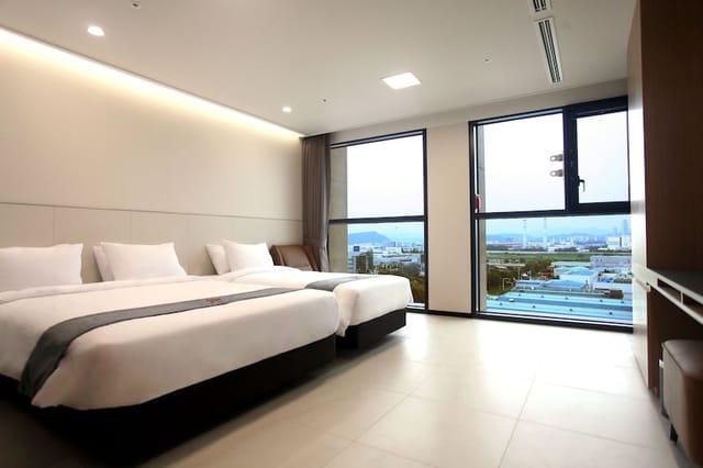 Rooftop terrace at Skypark Hotel with large windows, perfect for business events and relaxation.