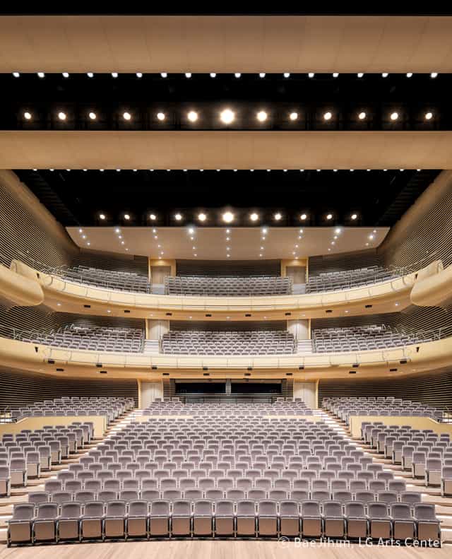Modern auditorium with tiered seating at LG Arts Center Seoul for conferences and performances.