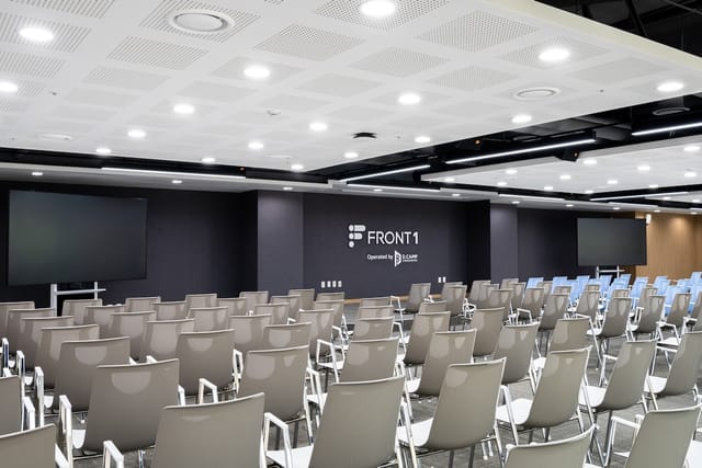 Modern event space with ergonomic chairs, ideal for conferences and corporate meetings.