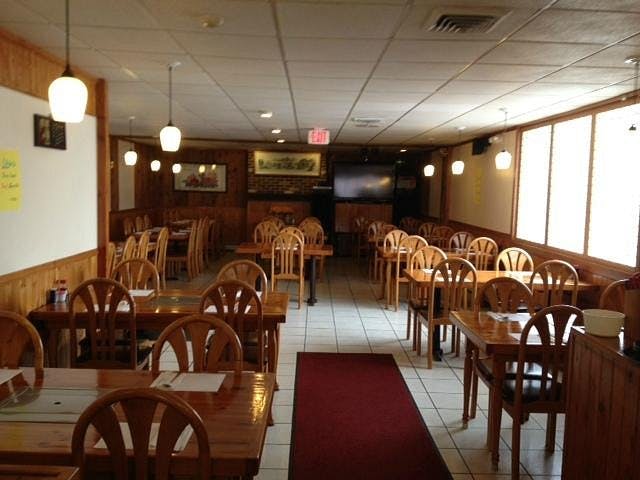 Cozy Korean restaurant with wooden tables, ideal for intimate gatherings and meetings.