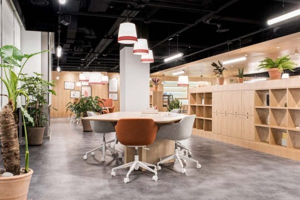 Modern co-working space with round table for collaborative meetings and brainstorming.