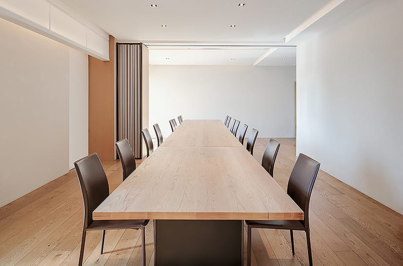 Modern conference room with wooden table for strategic meetings in Seoul hotel.