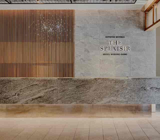 Modern banquet hall with polished stone reception for corporate events in Seoul.