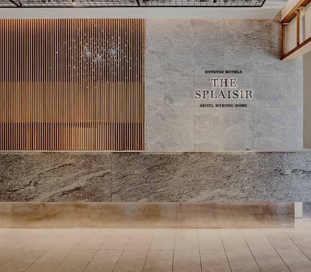 Modern banquet hall with polished stone reception for corporate events in Seoul.