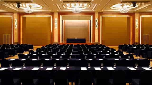 Conference room with elegant decor, ready for corporate seminar or event.