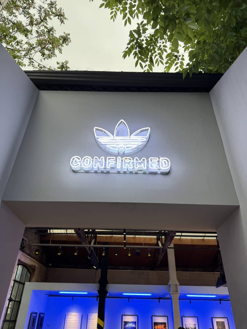 Adidas neon sign "CONFIRMED" at Layer57 event, ideal for brand activation and launches.