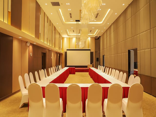 Ramada By Wyndham meeting room with U-shaped seating for conferences and workshops.