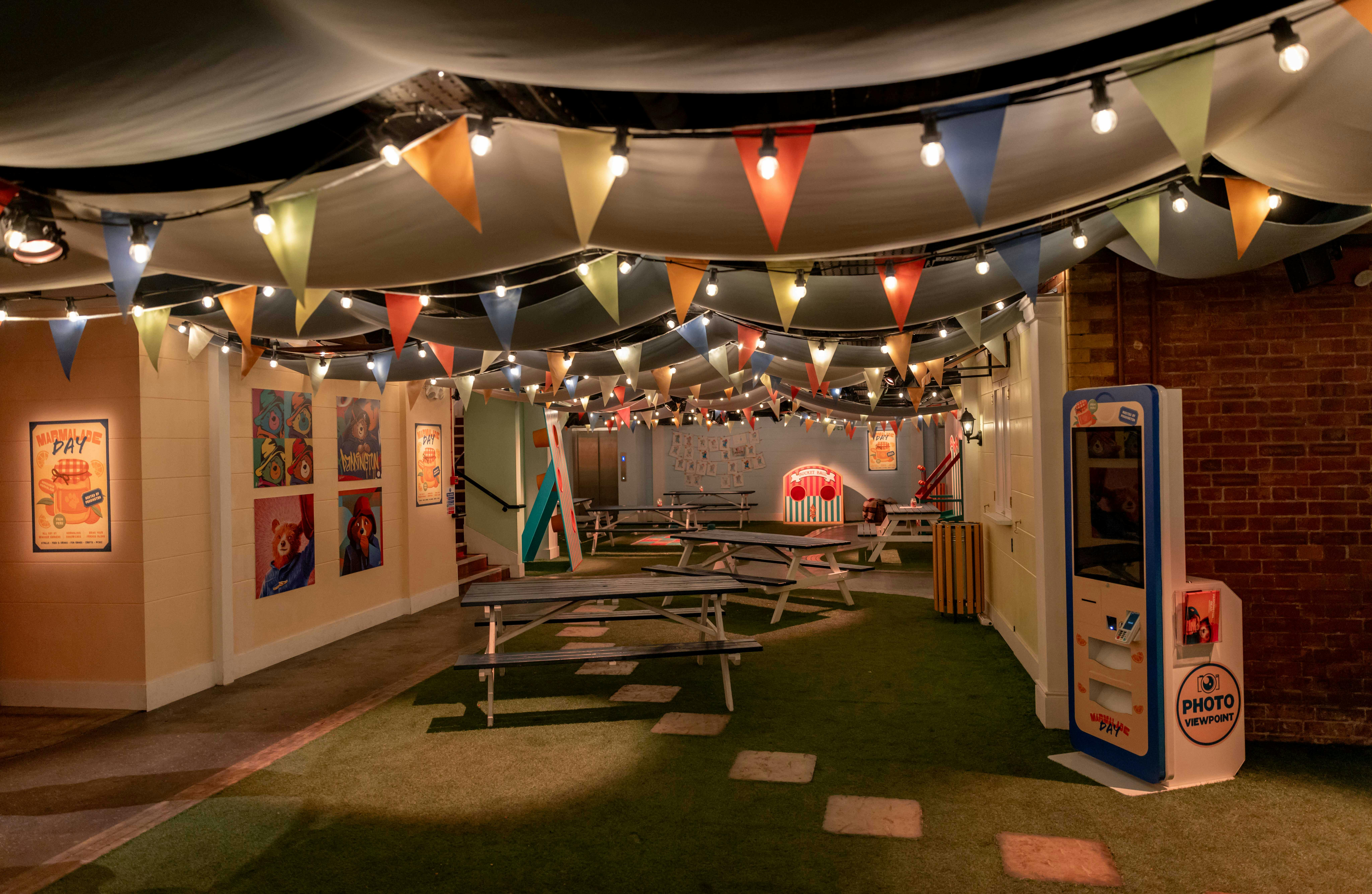 Vibrant Paddington Bear event space with picnic seating for team-building gatherings.