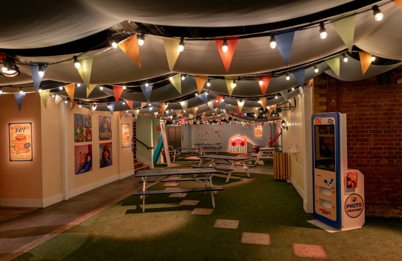 Vibrant Paddington Bear event space with picnic seating for team-building gatherings.