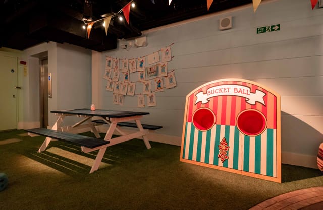 Vibrant event space with bucket ball game for team-building at Paddington Bear Experience.