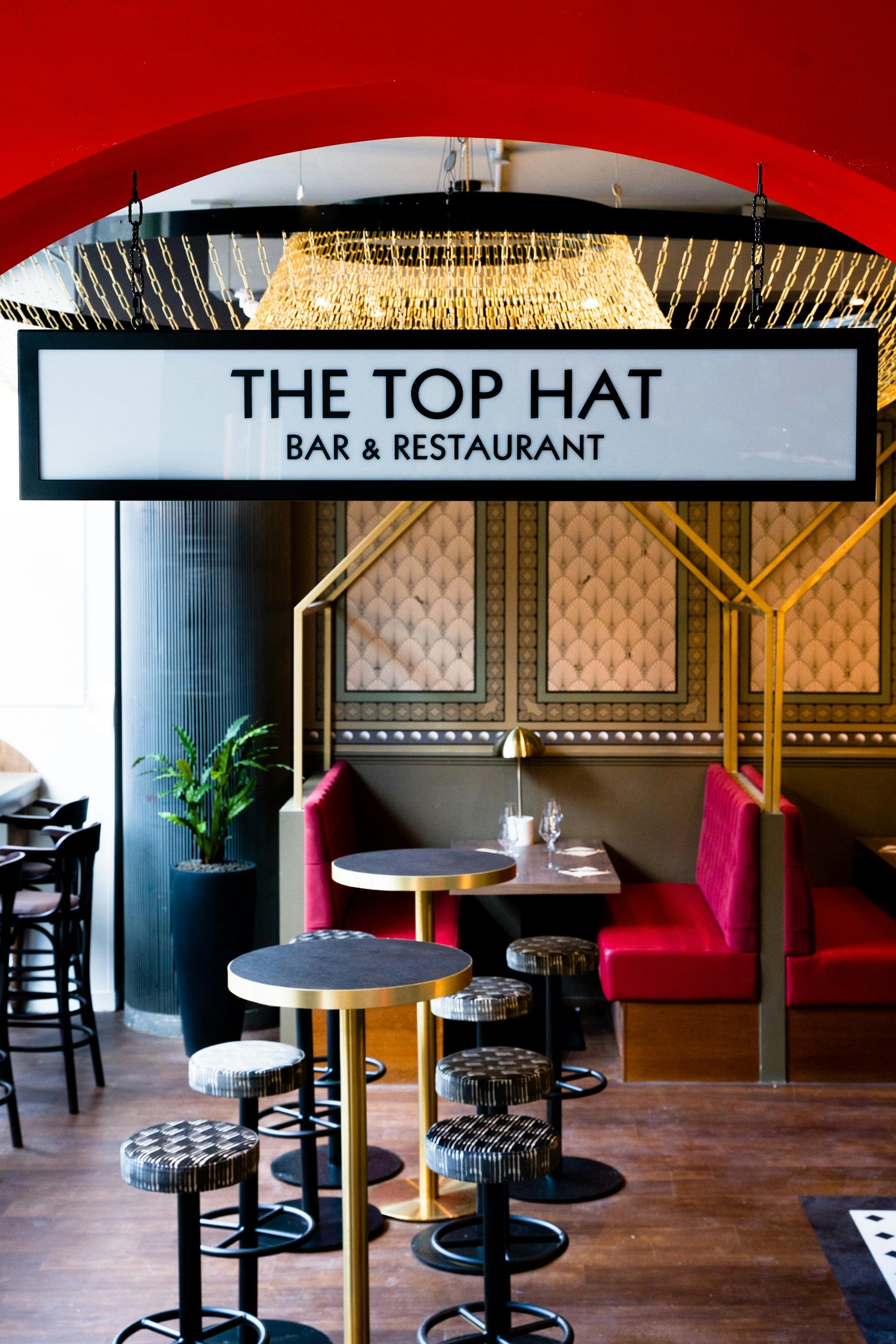 Semi-private hire at Top Hat Restaurant & Bar, featuring elegant decor for networking events.