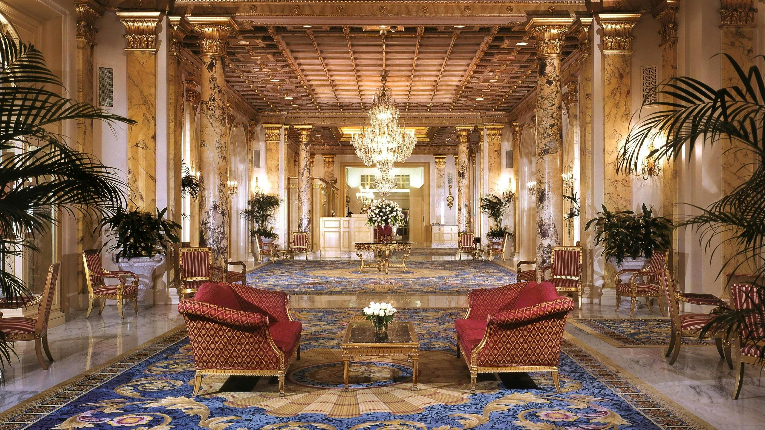 Opulent St. James Room lobby with grand chandelier, ideal for upscale events and meetings.