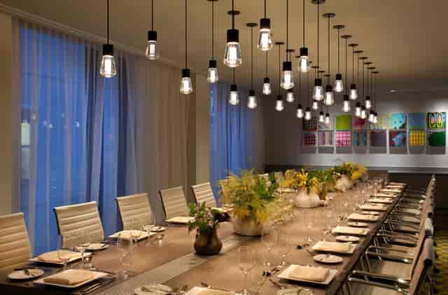 Modern Commonwealth Boardroom at The Eliot Hotel, ideal for meetings and events.