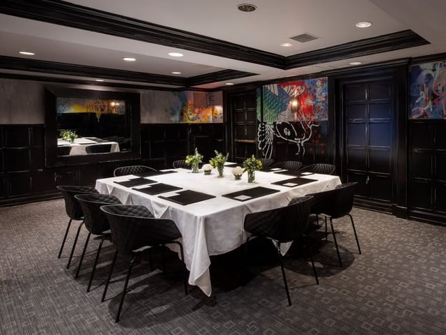 Sophisticated meeting room at The Eliot Hotel, perfect for exclusive events and gatherings.