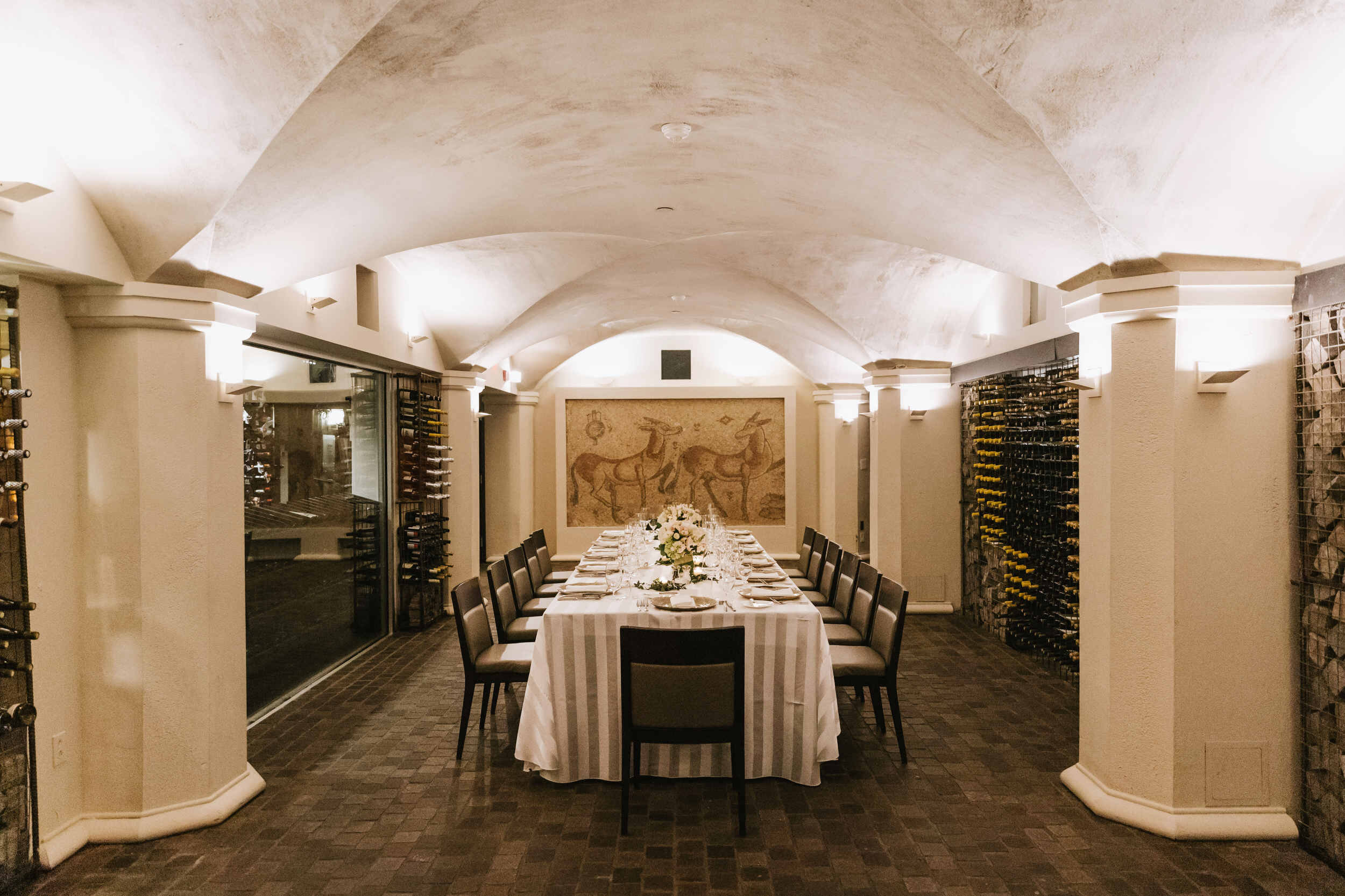 Elegant private dining room with arched ceilings for corporate events and intimate gatherings.