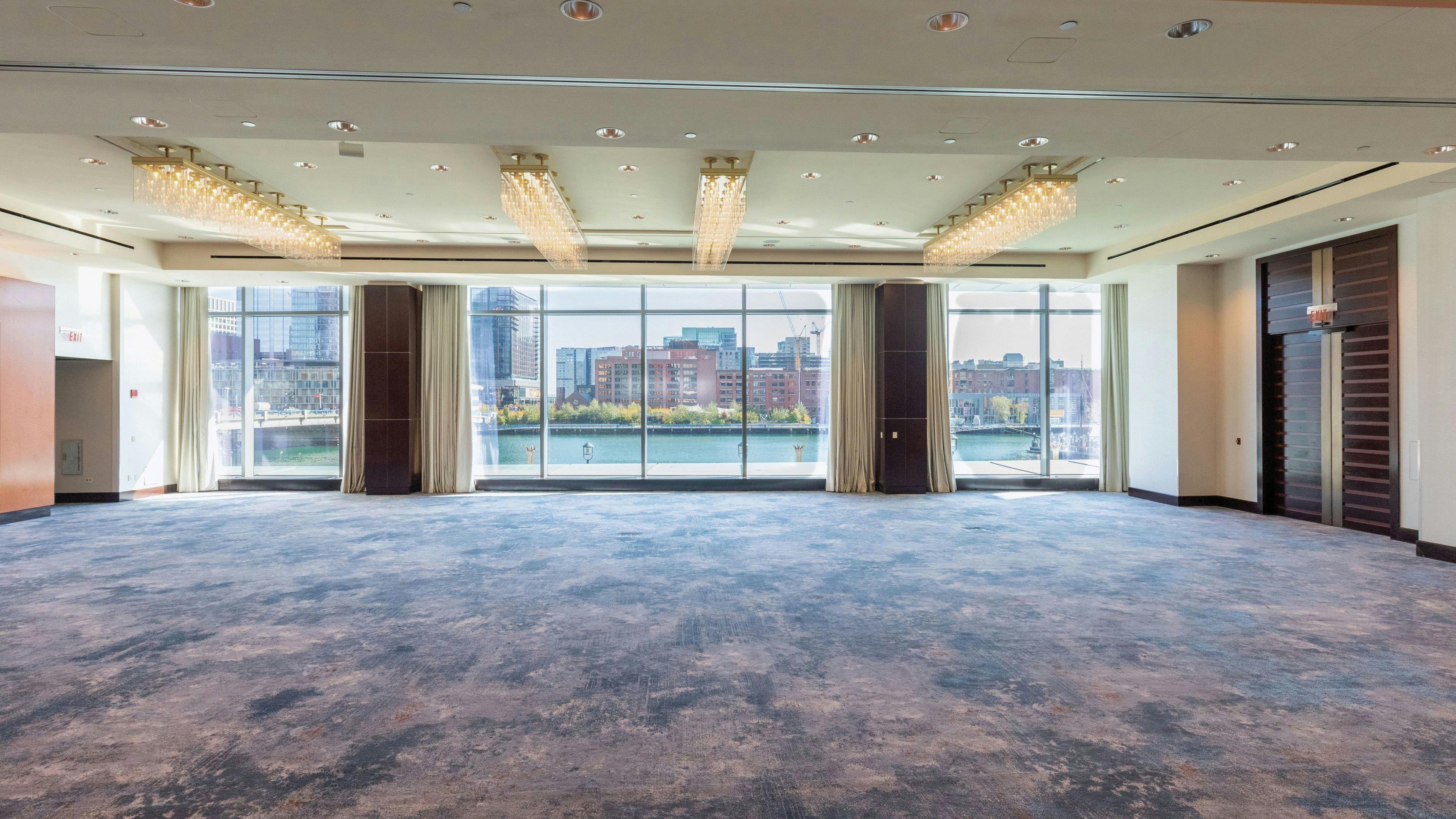 Spacious conference center in InterContinental Boston with large windows for events.