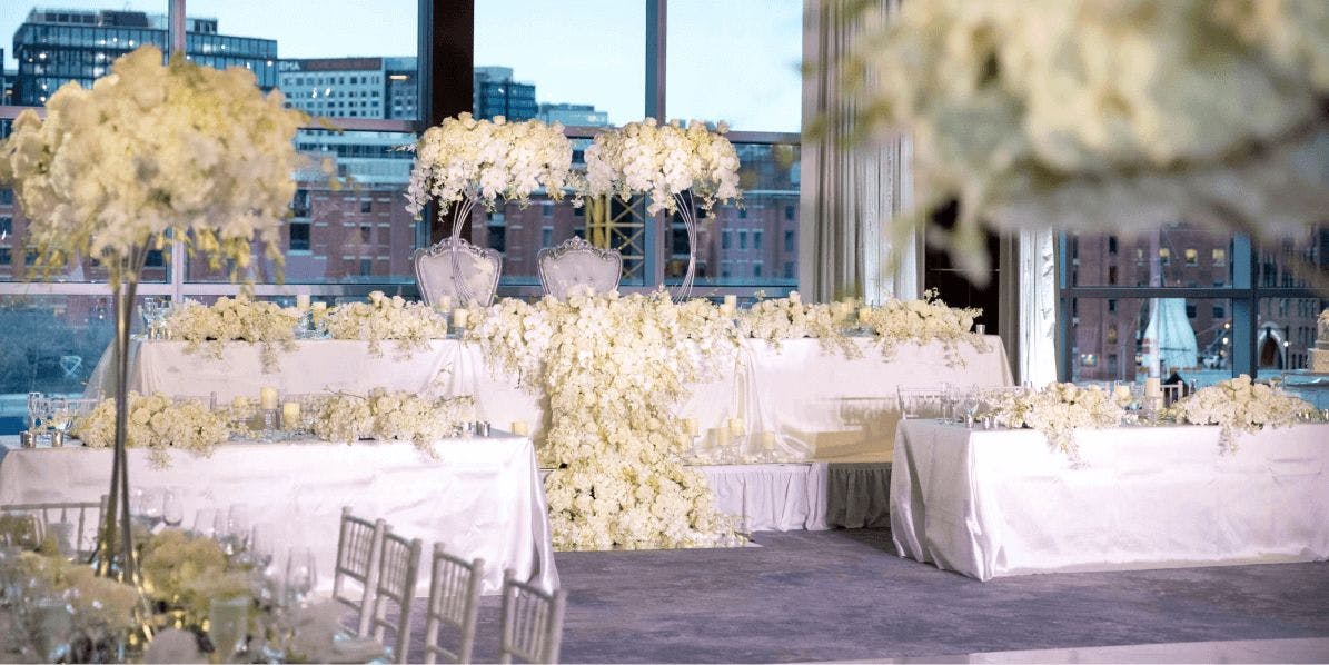 Rose Kennedy Ballroom with white floral arrangement, perfect for weddings and upscale events.