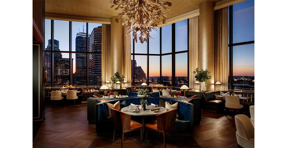 Raffles Ballroom in Boston: elegant dining space with city views for upscale events.