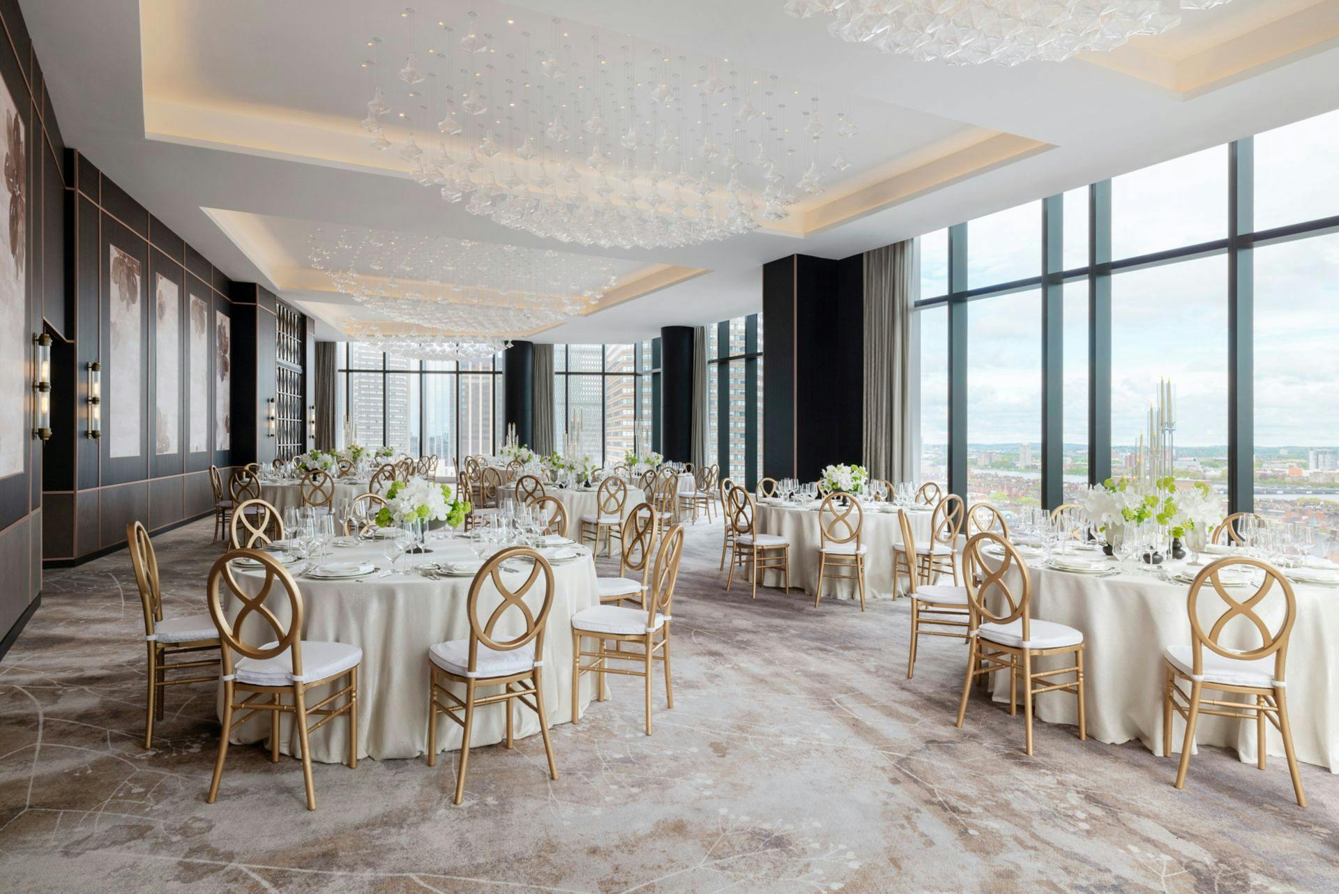 Elegant meeting room in Raffles Boston with round tables, ideal for corporate events and weddings.