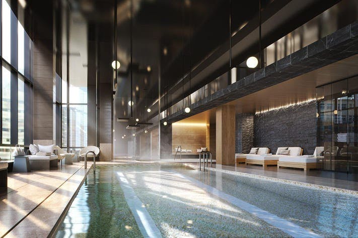 Sky Lobby at Raffles Boston: modern spa with tranquil pool for wellness retreats and events.