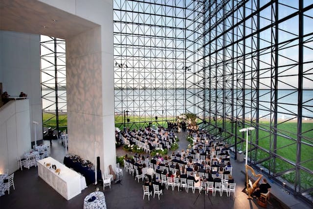 Modern event space with glass facade at JFK Presidential Library for conferences and weddings.