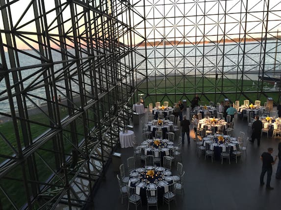 Modern event space at JFK Library with waterfront view, ideal for gatherings and corporate events.