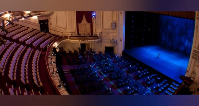 Main Hall at The Wilbur with tiered seating, ideal for conferences and performances.