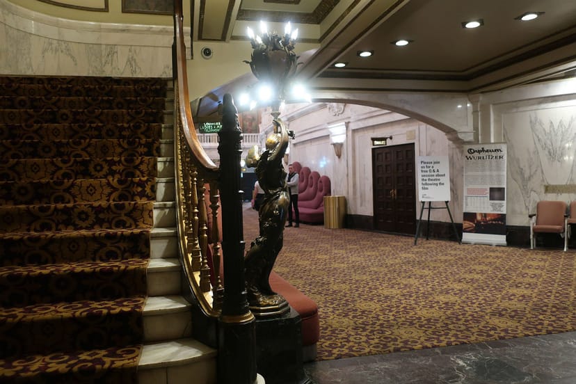 Elegant Orpheum Theatre lounge with grand staircase, ideal for upscale events and receptions.