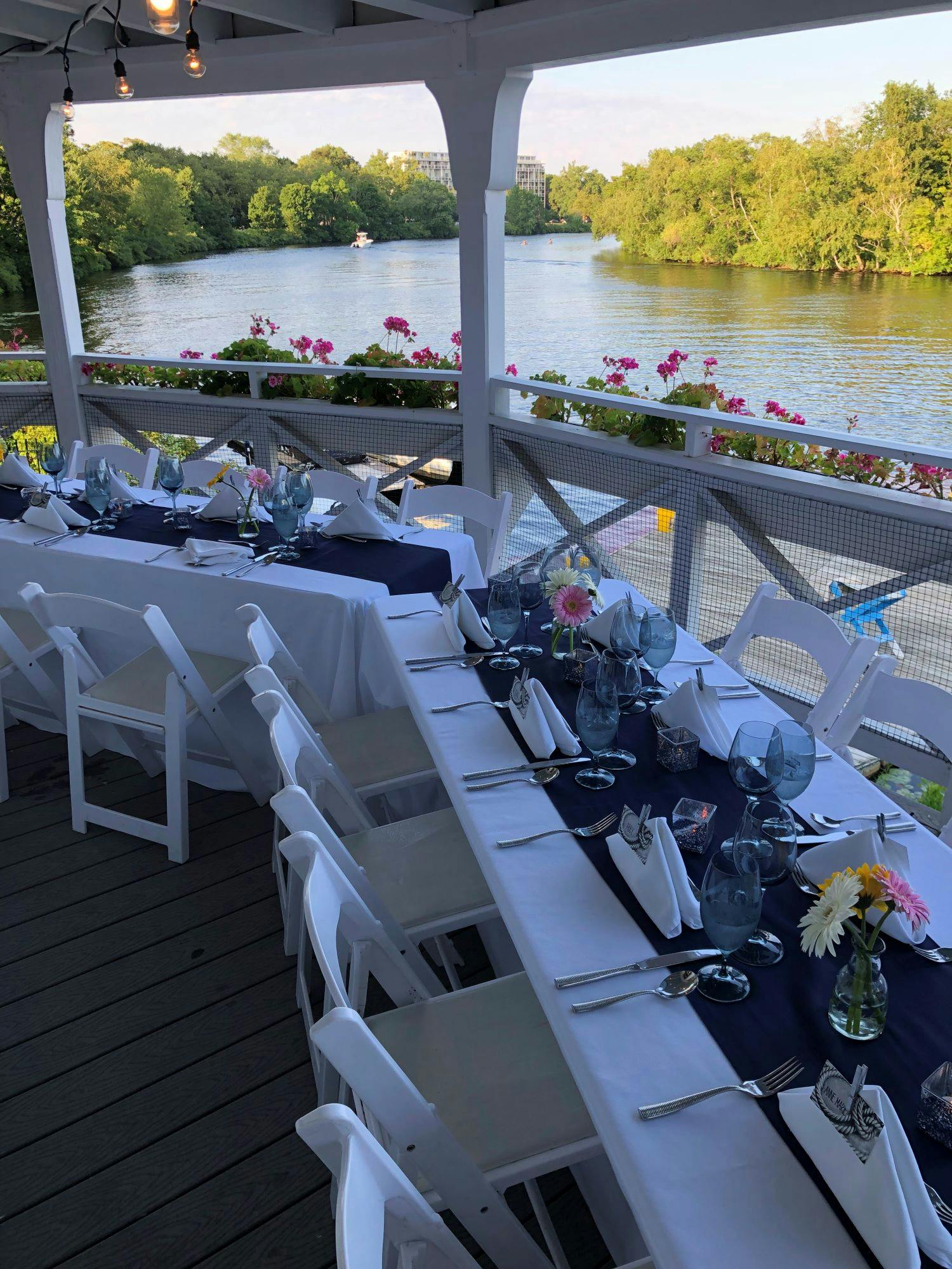 Elegant outdoor dining setup at Cambridge Boat Club for corporate events.