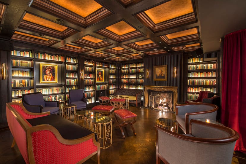 Sophisticated lounge with plush seating and fireplace, ideal for meetings and gatherings.