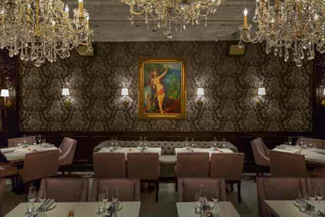 Elegant dining space with chandeliers for upscale events and intimate gatherings.