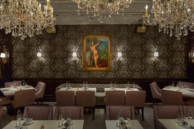 Elegant dining space with chandeliers for upscale events and intimate gatherings.