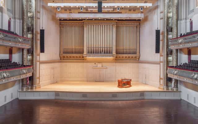 Higginson Hall auditorium with grand organ, perfect for concerts and events.
