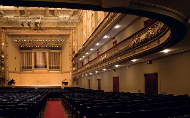 Higginson Hall auditorium with ornate architecture, perfect for elegant events and performances.