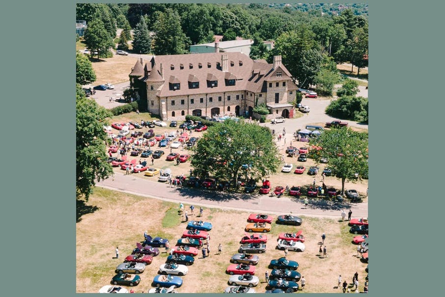 Classic car show at Larz Anderson Auto Museum with vibrant outdoor event atmosphere.