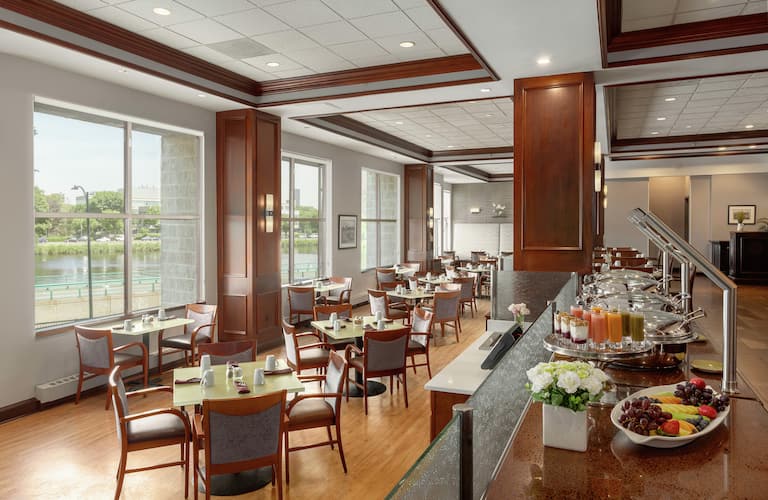 Dining area in DoubleTree Suites Boston, ideal for meetings and events with natural light.